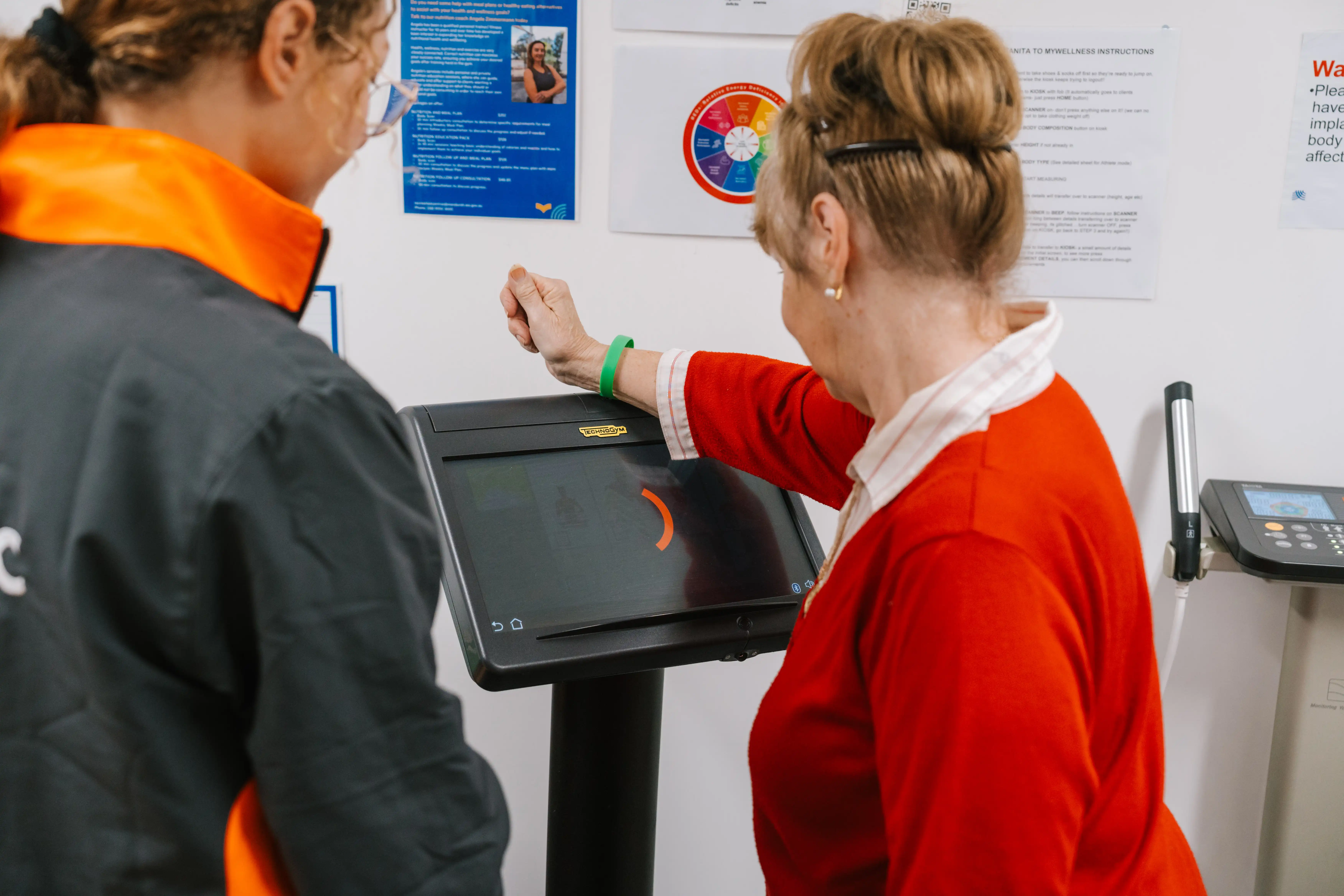 Person getting a gym fitness appraisal on equipment. 